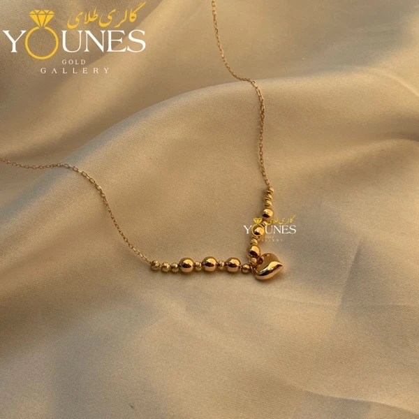 تصویر دوم گردنبند طلا قلب و گوی